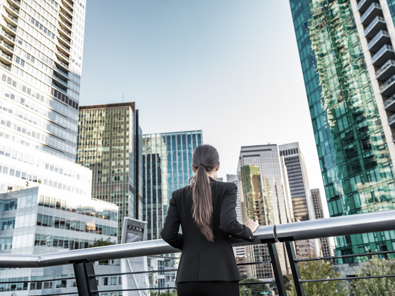 Woman looking up at skyline 